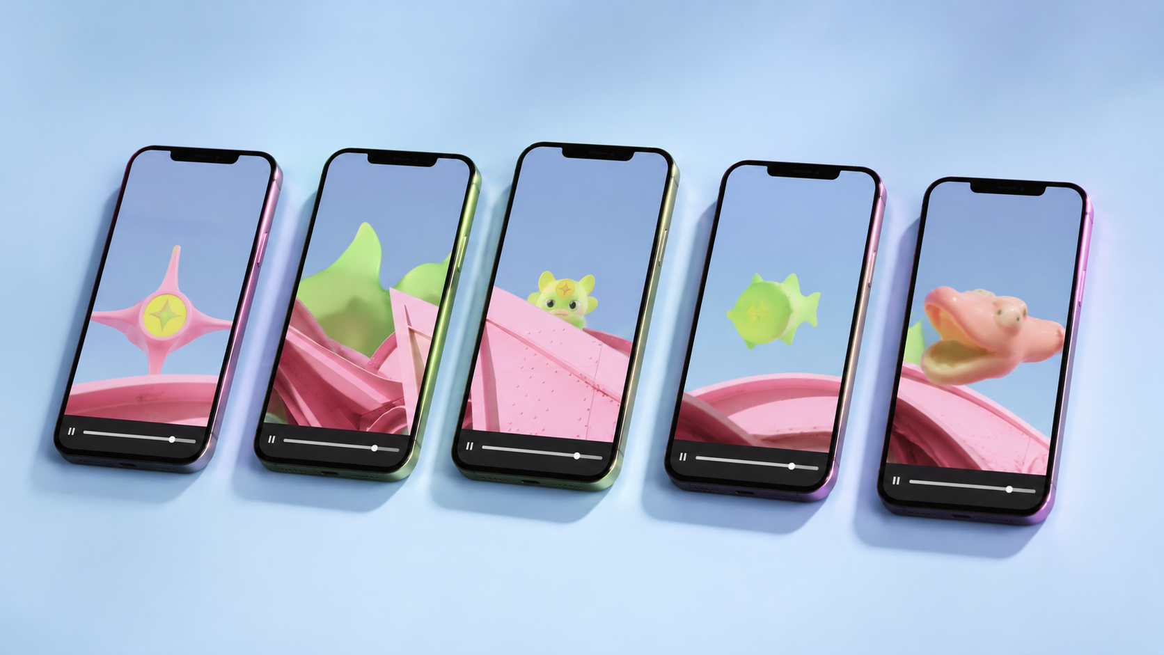 Five phones laid out in a row on a light-blue surface, each paused on a different second of the same vertical video. Each phone shows a frame from a soft-3D plastic mascot world (the Jeena star, a green-and-pink sculpture, a small yellow-green creature, a green fish, an orange duck-like shape) playing across a pink-and-green Calder-style structure. Each phone has a slightly different iridescent bezel tint.