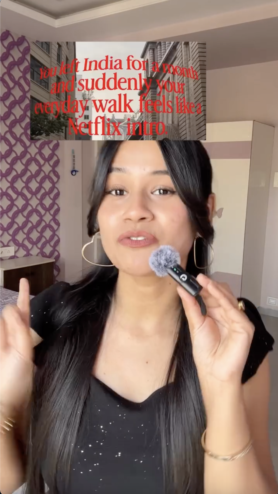Vertical screenshot from beauty_luxe_by_samrudhi's tutorial. A small image of a city street floats above her face with the trendy red serif font reading "You left India for a month and suddenly your everyday walk feels like a Netflix intro." Her face is fully visible below the caption.